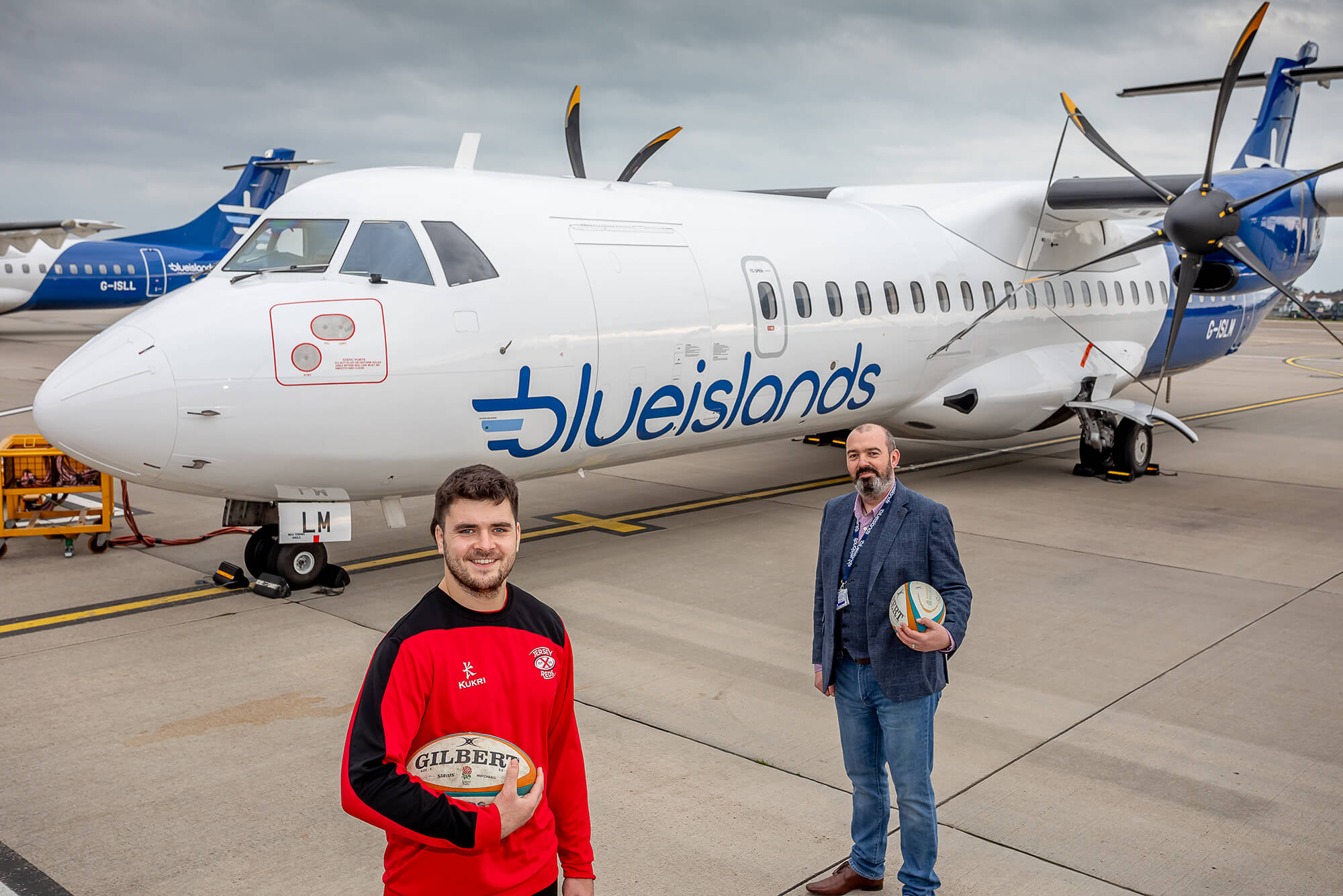 Jersey Red's captain Lewis Wynne with Blue Islands COO Dougie Hoblyn